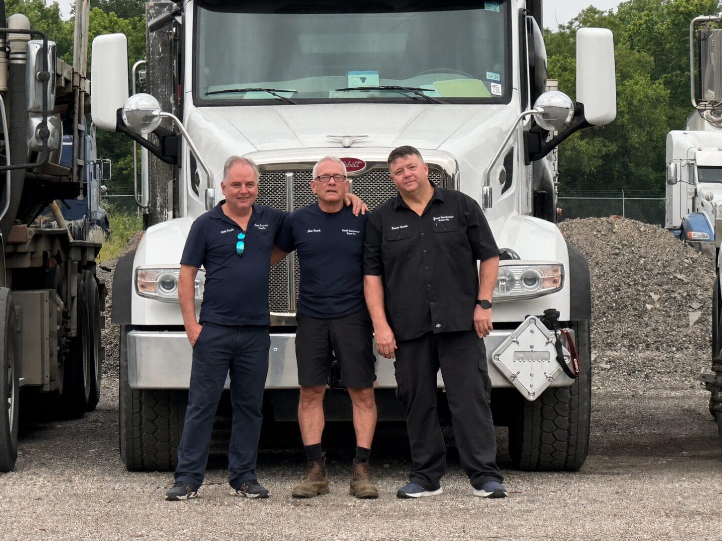 Trimble Environmental Service team standing in front of a vacuum truck at the company yard in Fort Worth, Texas.